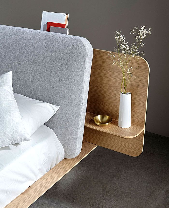 Bedroom with timber headboard and integrated side table